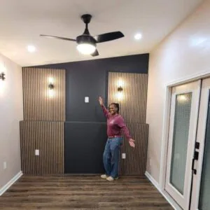 Person posing in modern room with accent wall Person posing in modern room with accent wall